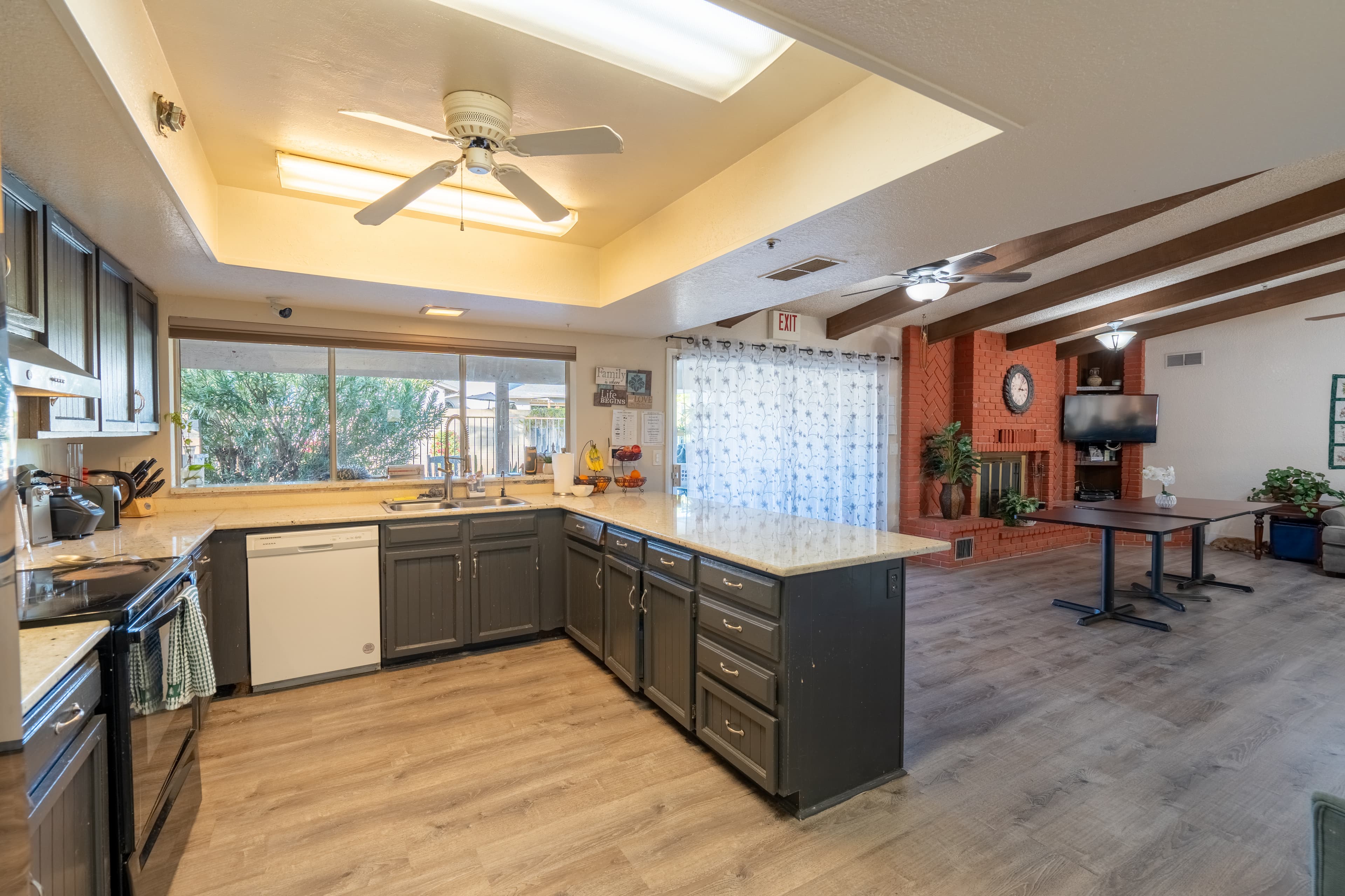 Bright living room with leather sofas and natural light
